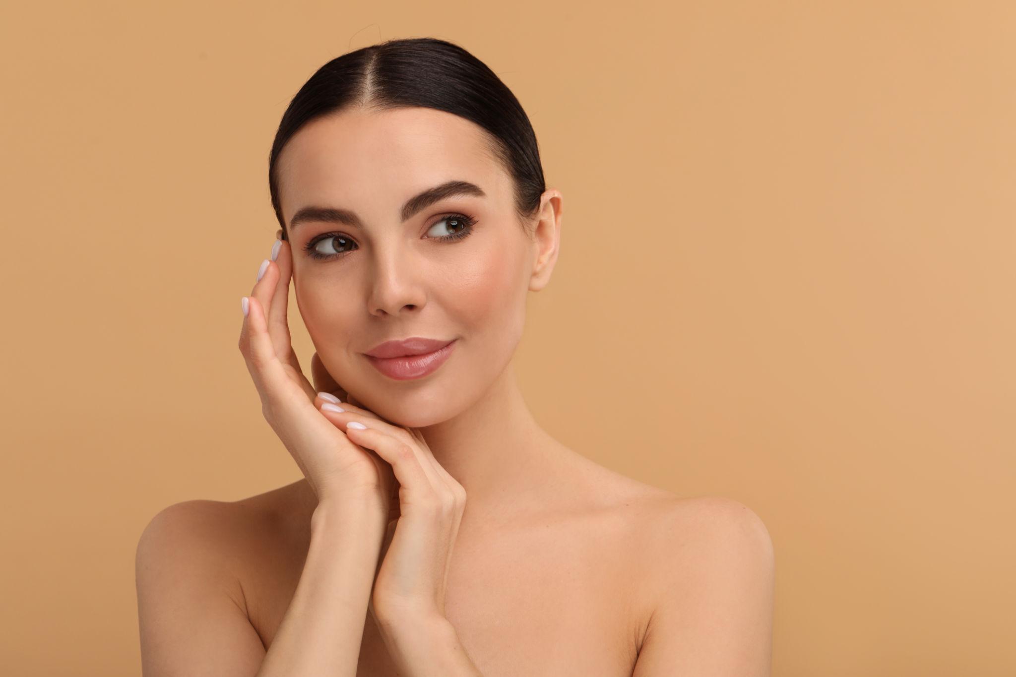 Woman with glowing youthful skin for collagen skincare article