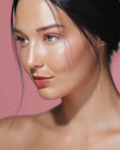 Radiant woman with hydrated glowing skin after a collagen skincare routine