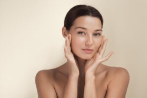 Beautiful woman with glowing hydrated skin and a radiant skincare look