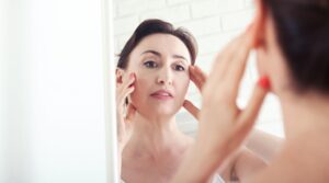 Woman with smooth glowing skin using collagen anti wrinkle skincare