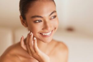 Natural beauty portrait of a woman with smooth radiant healthy-looking skin
